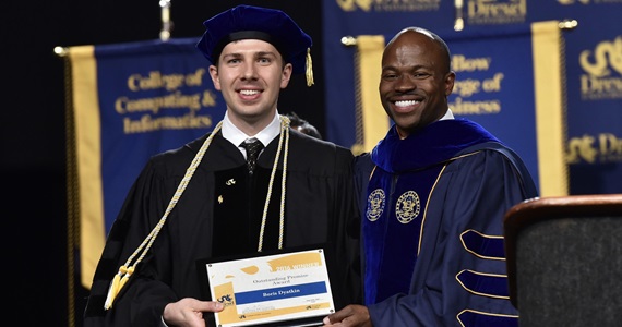 student-receiving-award-at-commencement